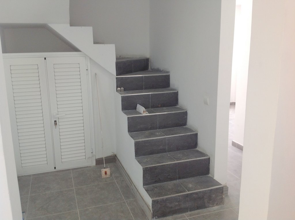 Tiling the stairs at Villa Torres